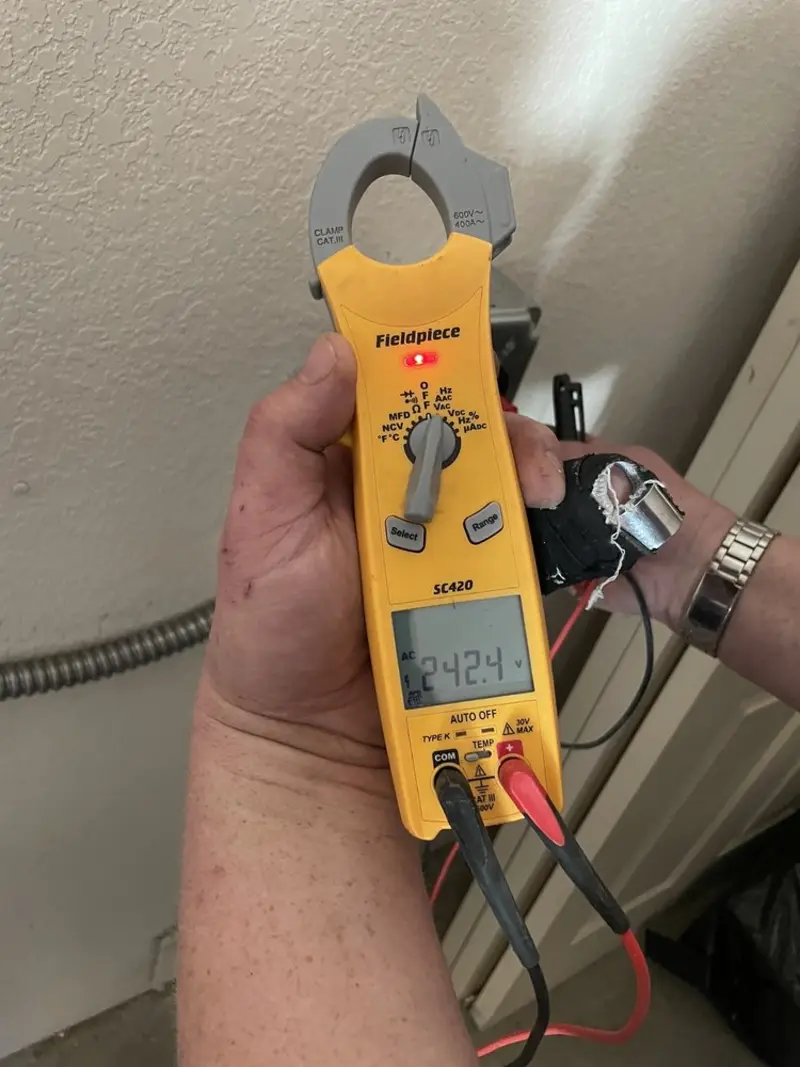 Voltage testing with clamp meter during Electrical Installation Services in Wade Hampton
